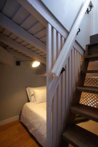 Cama ou camas em um quarto em Hotel da Oliveira