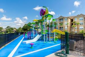 a playground at a resort with a slide at Fantastic Condo - 2 Miles from Disney Pool View Windsor Hills in Orlando