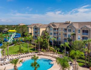 an aerial view of a resort with a pool and a playground at Fantastic Condo - 2 Miles from Disney Pool View Windsor Hills in Orlando