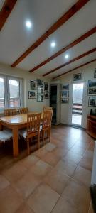 a dining room with a table and two chairs at Green House Source Vrilo in Tomislavgrad