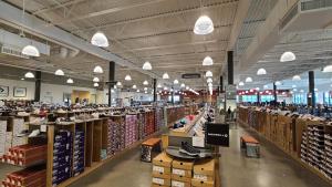 a large aisle of a store with lots of inventory at Private Room in Oliver 104 ave, Across Grand McEwan University, Norquest College, A Chic Location! in Edmonton