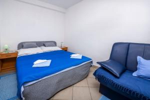 Postel nebo postele na pokoji v ubytování Apartments Sopic