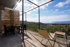 a balcony with a table and chairs and a view at Sea view apartment Dominique in Cavtat