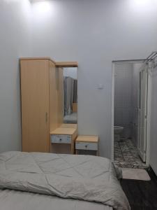 Ліжко або ліжка в номері Anyak's place Syariah