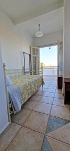 Ένα ή περισσότερα κρεβάτια σε δωμάτιο στο Beachlife: The Apartment