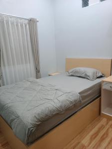 Ліжко або ліжка в номері Anyak's place Syariah