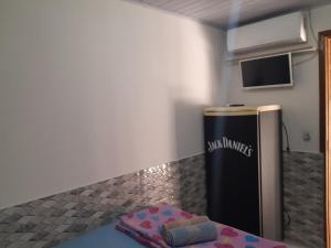 a kitchen with a black refrigerator in a room at Casa do Vo Lelo in Penha