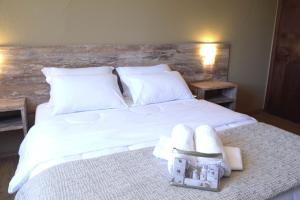 Cama ou camas em um quarto em Samuara Hotel Caxias do Sul