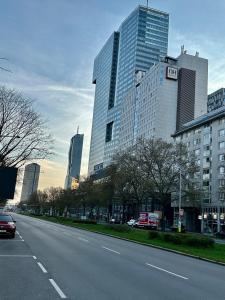 a city street with tall buildings in the background at Amazing City Center Apartment in Vienna