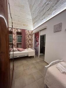 Voodi või voodid majutusasutuse B&B LE CUSPIDI toas