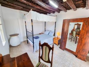 a bedroom with a bed and a mirror at Poseidon's Pool Paradise in Skarinou
