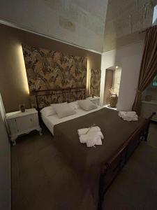 Voodi või voodid majutusasutuse B&B LE CUSPIDI toas