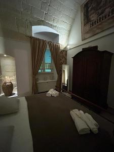 Voodi või voodid majutusasutuse B&B LE CUSPIDI toas