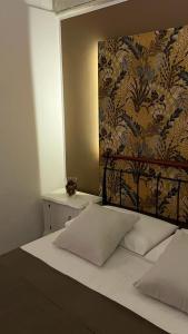 Voodi või voodid majutusasutuse B&B LE CUSPIDI toas