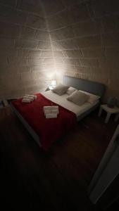 Voodi või voodid majutusasutuse B&B LE CUSPIDI toas
