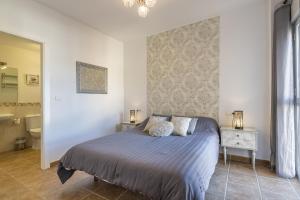 Postel nebo postele na pokoji v ubytování ÁTICO ATALAYA Parking privado gratis + 23 fotografií
