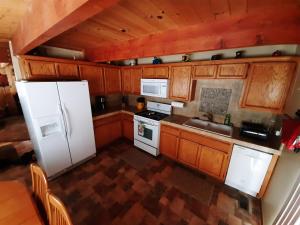 an overhead view of a kitchen with white appliances at Cabin on the Corner in Big Bear Lake
