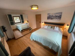 A bed or beds in a room at Haus Almrausch