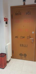 a door with writings on it in a building at Alice nel paese delle meraviglie 