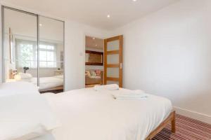 A bed or beds in a room at Inviting & Peaceful 1BD flat in Lambeth