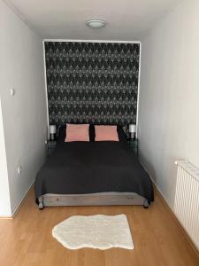 Postel nebo postele na pokoji v ubytování Belvárosi apartman + 37 fotografií