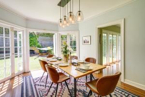 a dining room with a table and chairs at Berkeley Home with Garden, Close to San Francisco! in Berkeley