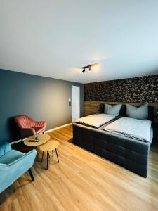 En eller flere senge i et værelse på Ferienhaus Rost
