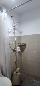 a bathroom with a shower and a toilet in it at Jr. 1Bedroom @ Avida Aspira in Cagayan de Oro