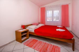 Postel nebo postele na pokoji v ubytování Apartments Sopic