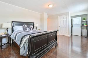 a bedroom with a bed and a table and a refrigerator at 653 3rd St Unit 2 After Dune Delight in Somers Point