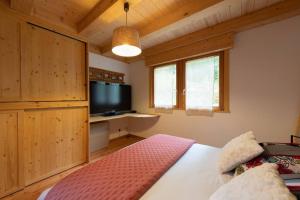 Posteľ alebo postele v izbe v ubytovaní L’Ecrin Blanc – Cocon familial avec jacuzzi et salle de jeux