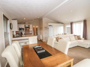 a living room with a couch and a table at Walkers Rest in Carnforth