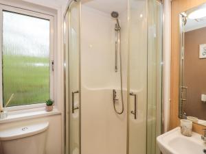 a bathroom with a shower and a sink at Walkers Rest in Carnforth +28 photos