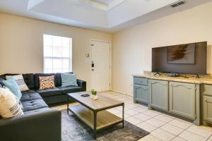 a living room with a couch and a table at Lovely Mission Apartment in Prime Location! in Mission