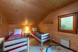 Posteľ alebo postele v izbe v ubytovaní Chalet avec sauna, magnifique vue et à 400m des pistes