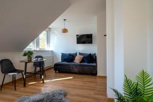 a living room with a couch and a table at Centrum Bieszczad in Lutowiska