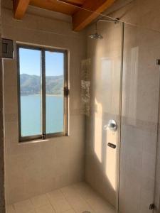 a bathroom with a shower and a window at the best view in Valle de Bravo in Valle de Bravo
