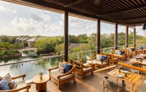 a restaurant with a view of the water at Fairmont Mayakoba in Playa del Carmen