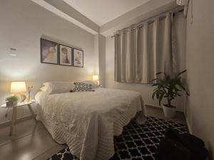 Ένα ή περισσότερα κρεβάτια σε δωμάτιο στο CASA_ESTRELA