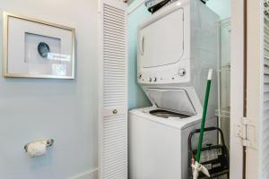 a washer and dryer in a laundry room at Bungalows at Seagrove 135 - MerSea in Seagrove Beach