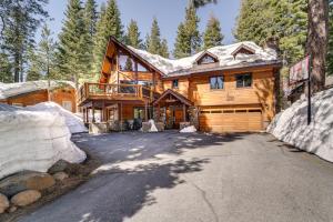 a large wooden house with a garage at One Moose Lodge with Hot Tub in Tahoe Donner in Truckee