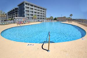 a large swimming pool in the middle of a beach at Myrtle Beach Resort A-326 in Myrtle Beach