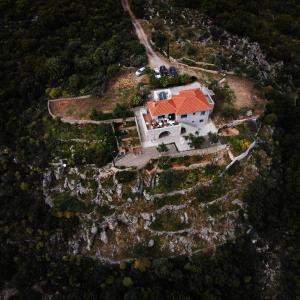 an aerial view of a house on a mountain at Athina's Stone House in Kardamyli in Kardamili
