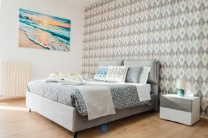 Postel nebo postele na pokoji v ubytování DOMUS 73 Apulian holidays