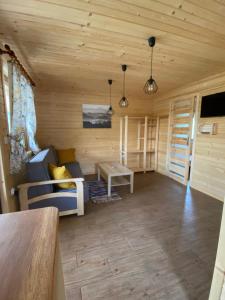 a living room with a couch and a table at U dziewczyn w Terce in Terka
