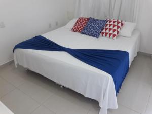 Cama ou camas em um quarto em Hotel Maricá