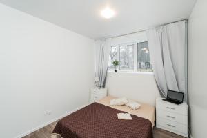 a small bedroom with a bed and a window at Kalniečių st 126A Kaunas Students Home LT in Kaunas