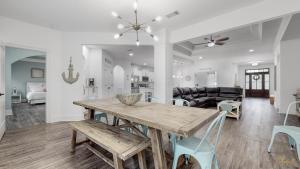 a dining room and living room with a table and chairs at Resort-Style Pool! - Minutes to Beach! - FLSRB2 in Santa Rosa Beach