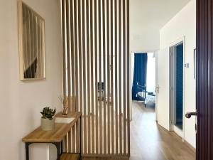 a hallway with a striped wall in a house at Taormina Casa Sarina in Taormina