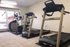 a gym with two exercise bikes in a room at Quality Inn & Conference Centre Festival in Stratford